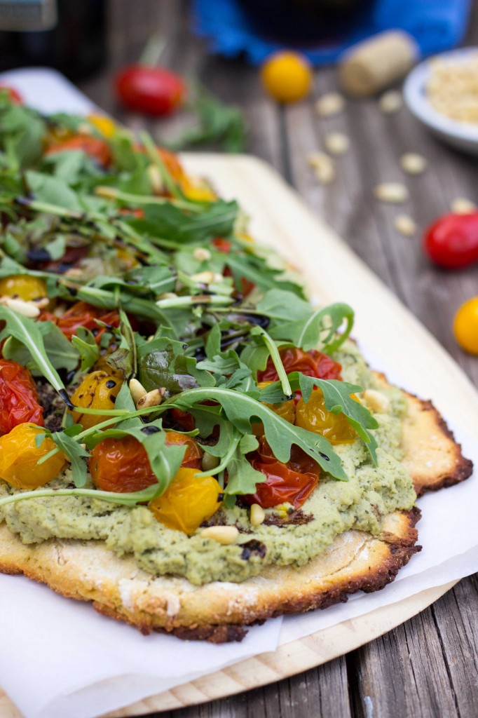 Basil Roasted Garlic Ricotta Pizza with Roasted Cherry Tomatoes Arugula Baslamic Reduction