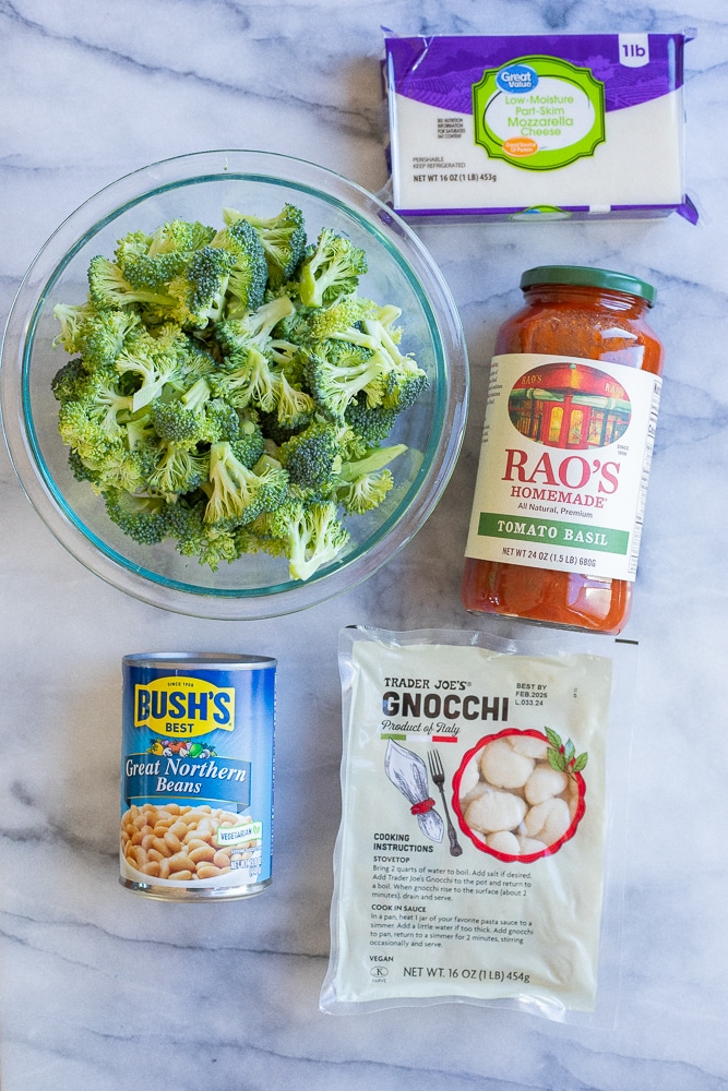 showing the 5 ingredients needed to make this easy vegetarian gnocchi broccoli white bean bake.