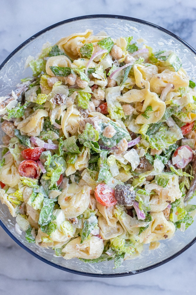 vegetarian tortellini pasta salad mixed up in a bowl