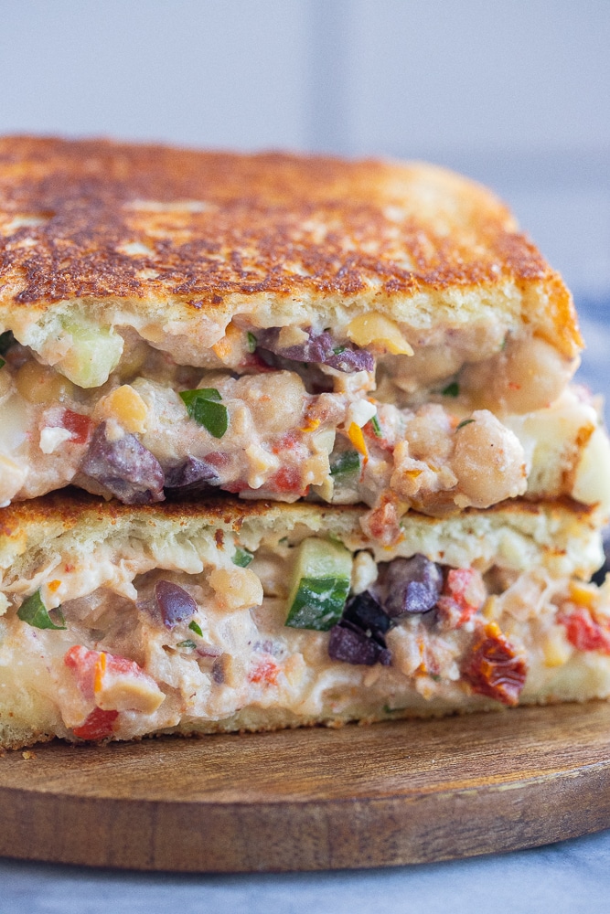 close up of a greek chickpea melt with cucumber and kalamata olives