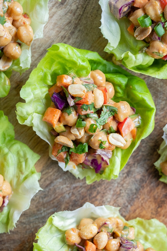 chickpea lettuce wraps with peanut sauce on a cutting board