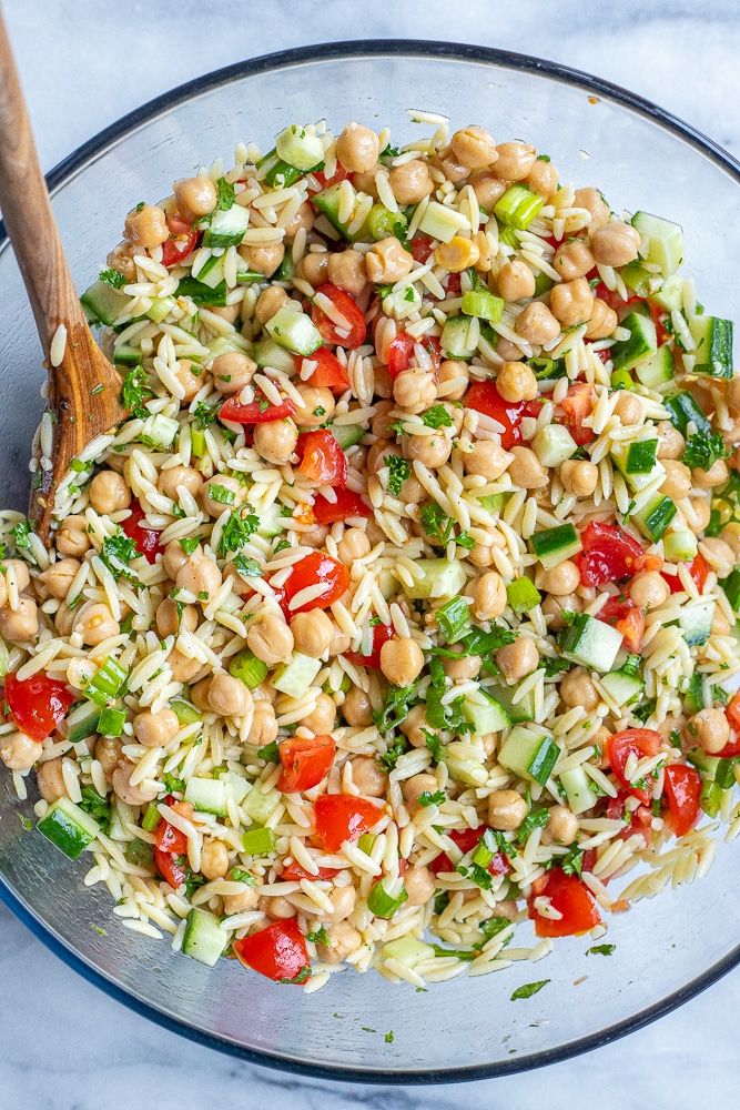 large bowl of tabouli salad with orzo and chickpeas