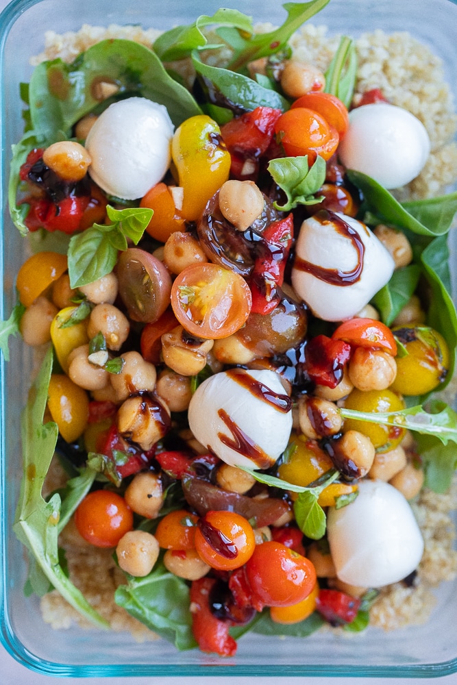 close up of a caprese quinoa meal prep lunch bowl with balsamic glaze