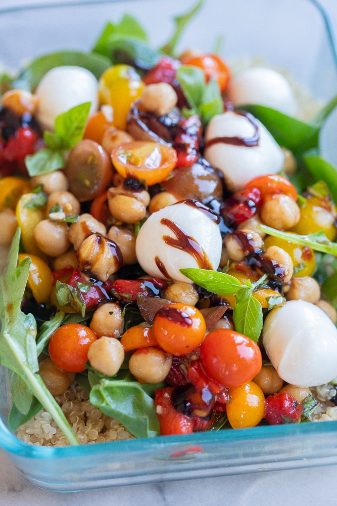 close up of a mozzarella ball in these caprese quinoa salad lunch bowls