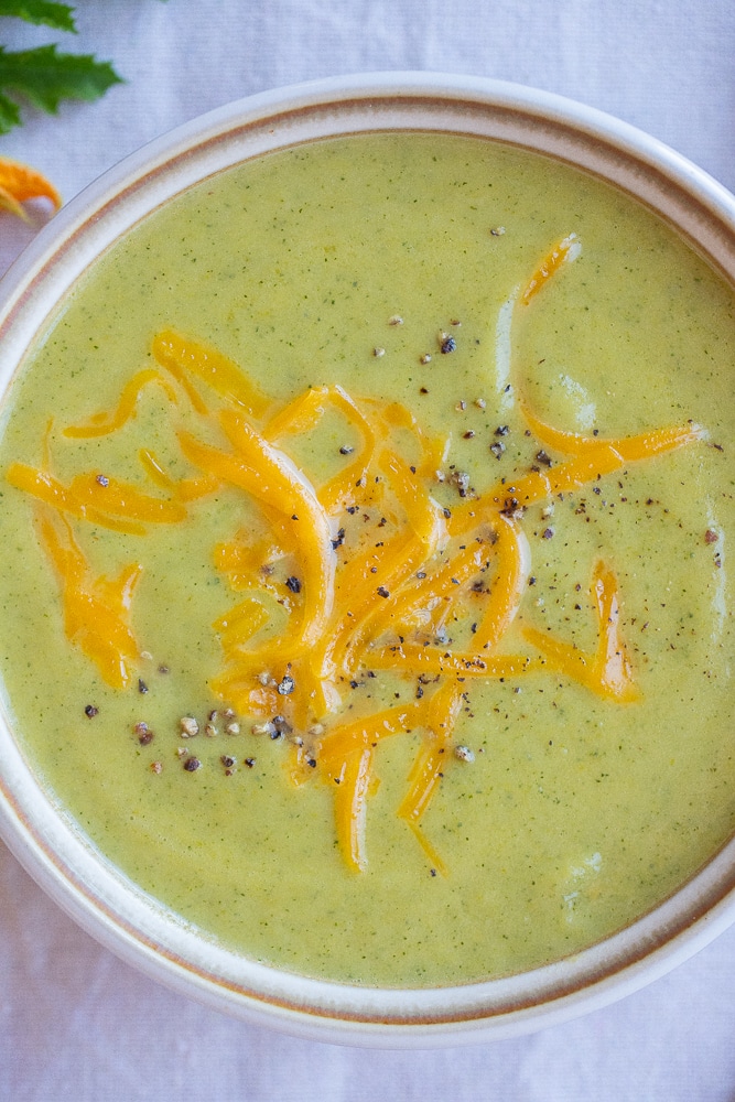 cozy bowl of zucchini cheddar soup with black pepper