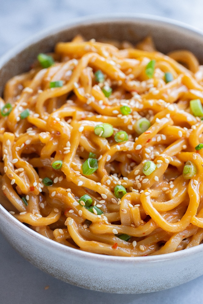 close up of creamy coconut noodles in a bowl