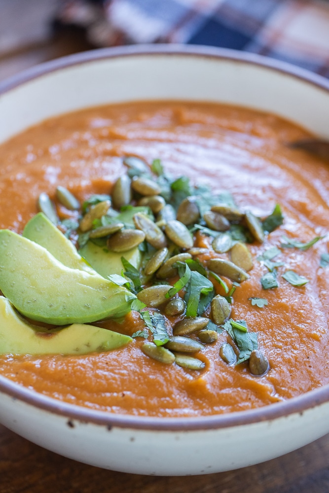 close up of a bowl of Mexican inspired pinto bean and pumpkin soup