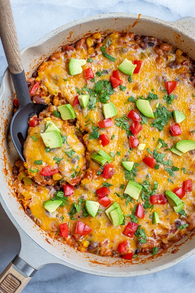 black bean taco skillet with taco toppings in a pan