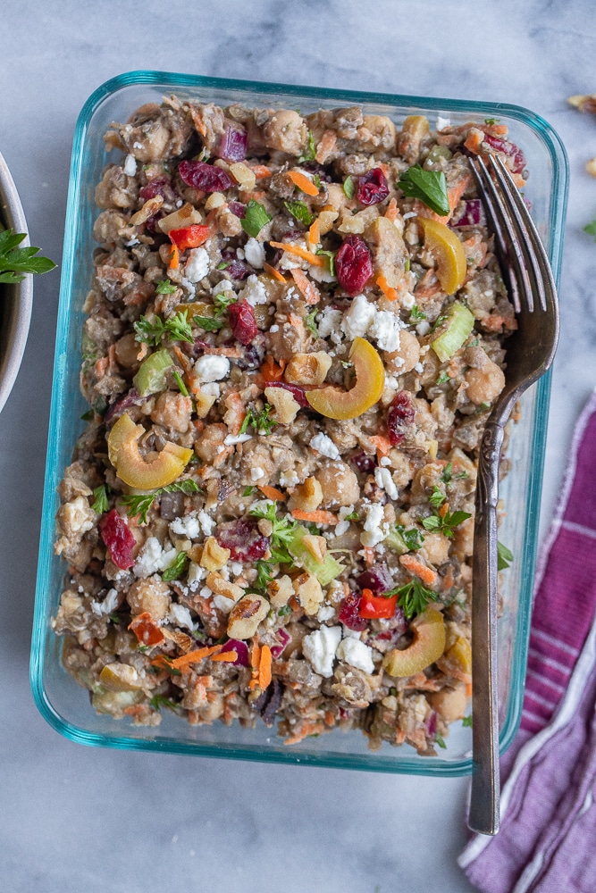 close up of loaded lentil salad in a meal prep container