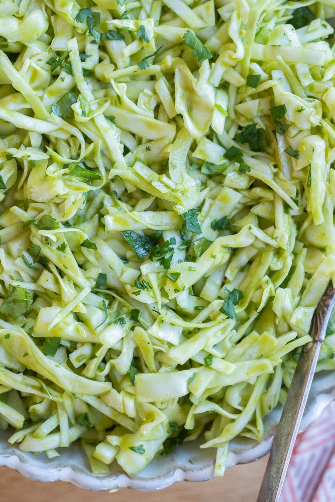 close up of this refreshing cilantro lime slaw in a serving bowl