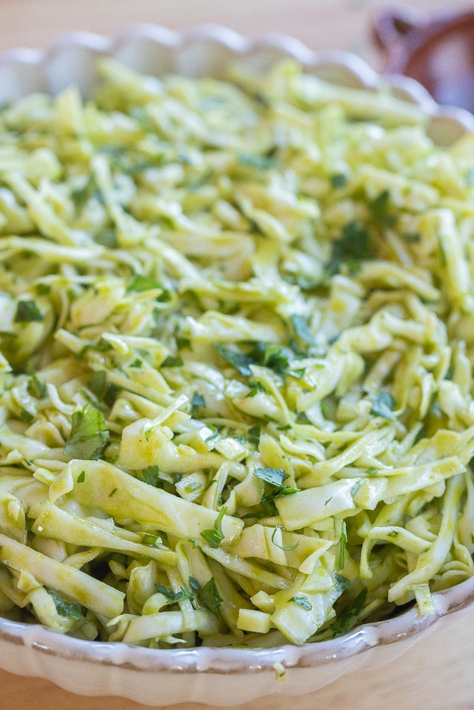 close up of a bowl of cilantro lime coleslaw