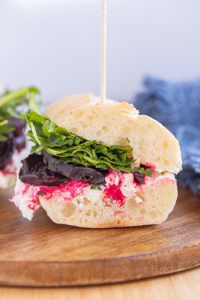 close up of a roasted beet sandwich cut in half