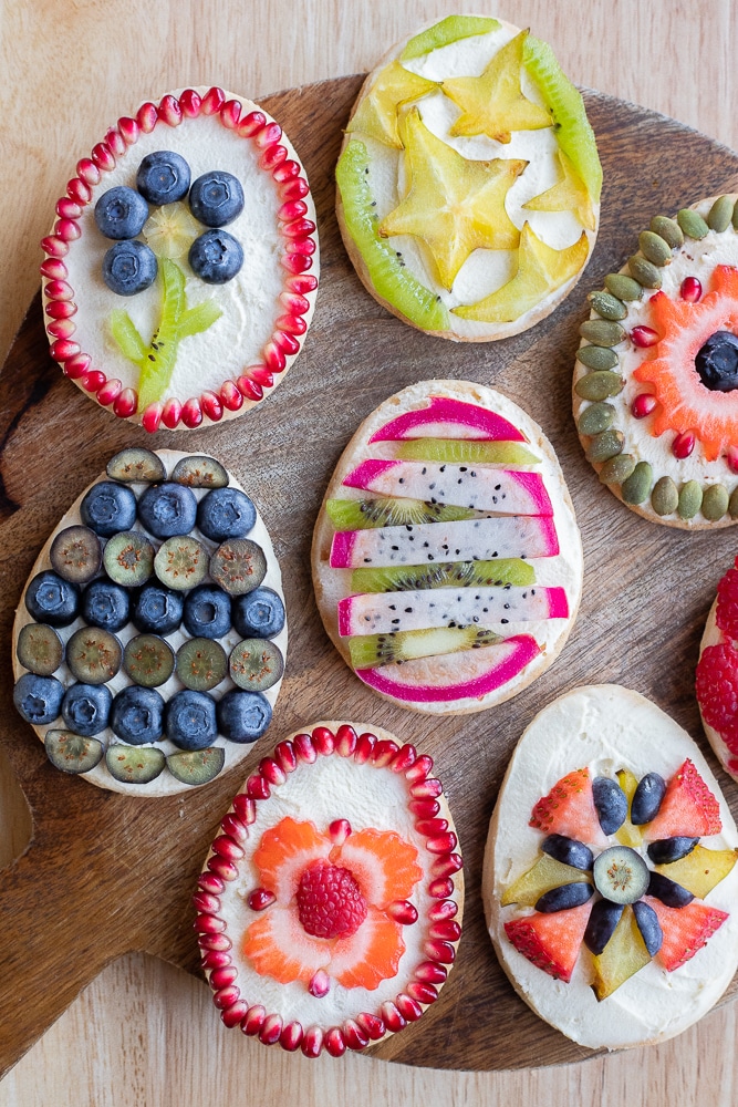 cutting boards showcasing different designs on these Fruit Tart Easter Egg Cookies